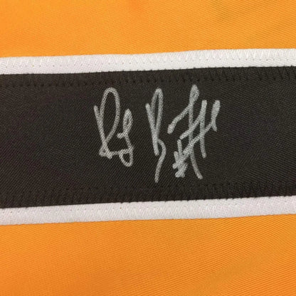 Orange and black fabric with white embroidered signature on Rare Ray Bourque jersey for professional sports league