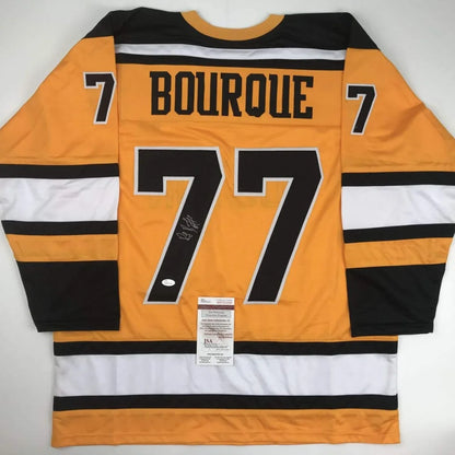 Autographed Ray Bourque #77 hockey jersey from professional sports league display