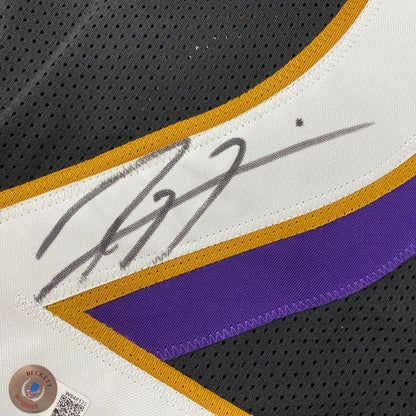 Autographed los angeles lakers custom jersey in white purple and gold representing professional sports league memorabilia