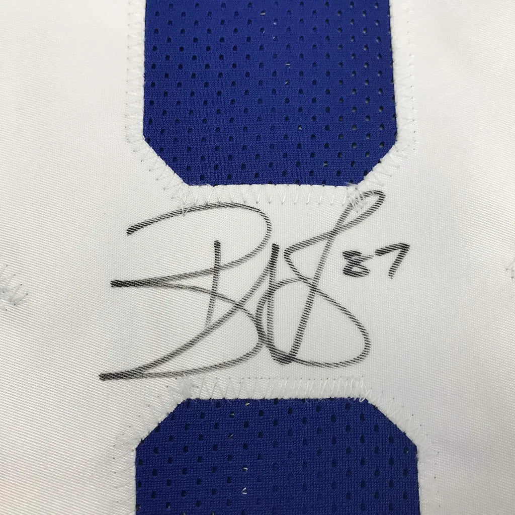 Autographed blue and white mesh custom jersey signed by Reggie Wayne from professional sports league with Beckett BAS COA