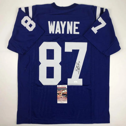 Back view of a royal blue custom jersey featuring wayne 87 signed by reggie wayne from a professional sports league