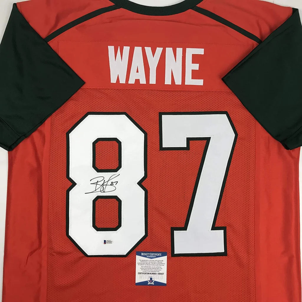 Back of a red and black custom jersey featuring white number 87 and signed name wayne from professional sports league