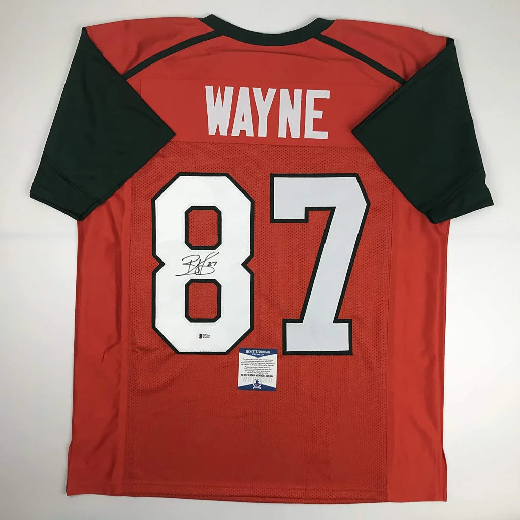 Back of red and black custom jersey featuring number 87 and wayne with autograph inside the numeral from professional sports league