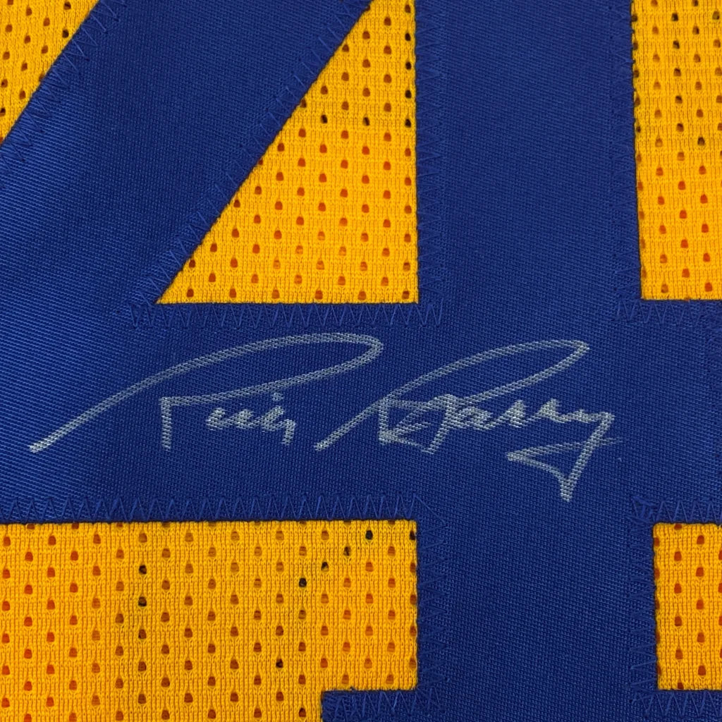 Autographed yellow and blue professional sports league jersey collectible
