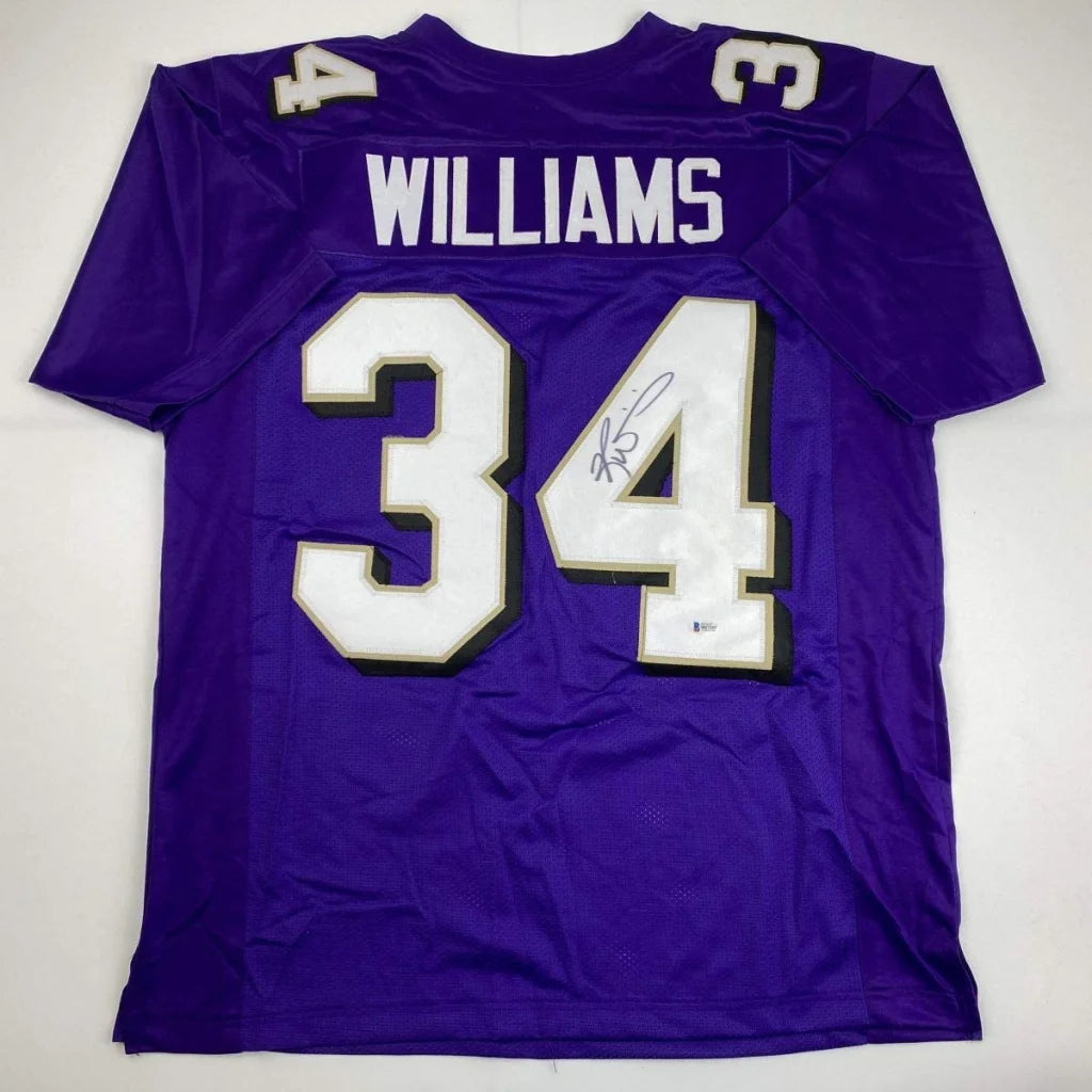 Purple custom jersey with white and black numbers and signature for professional sports