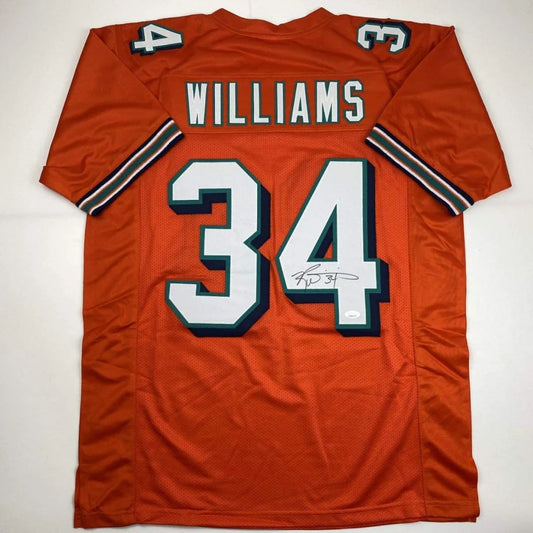 Autographed orange miami dolphins custom jersey signed by ricky williams with white and teal lettering number 34 professional sports league