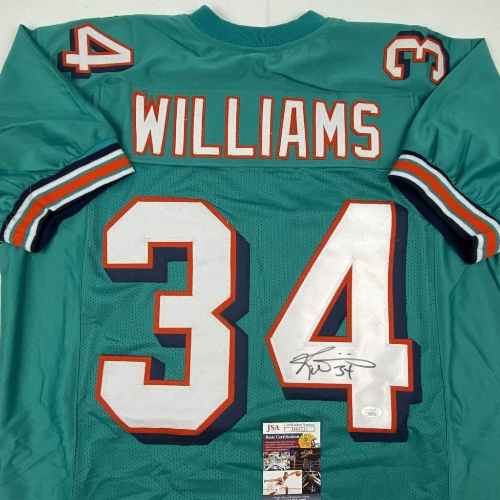 Back of autographed Ricky Williams teal Miami Dolphins custom jersey, number 34, JSA COA