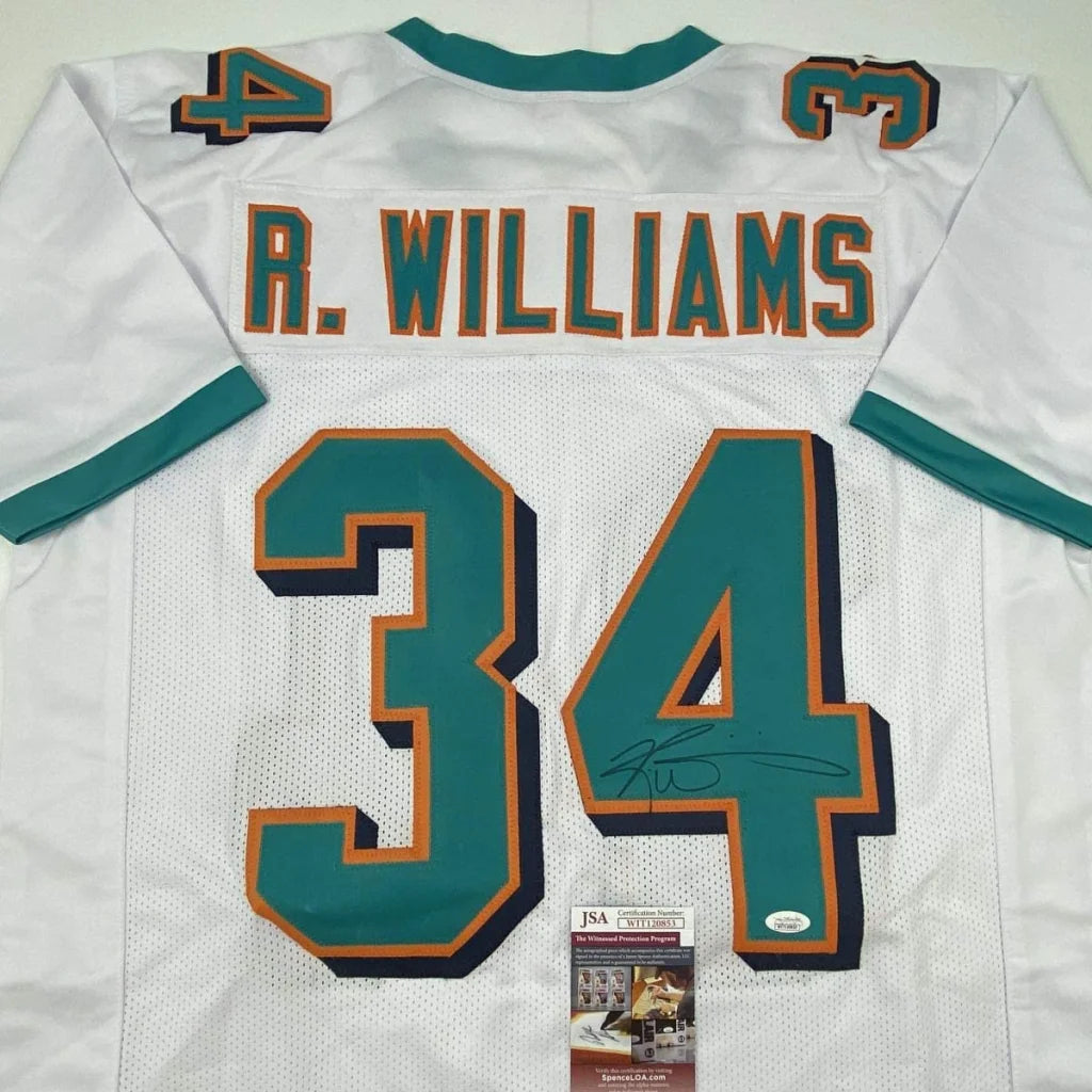 White Miami dolphins custom jersey with teal and orange lettering autographed by Ricky Williams for professional sports fans