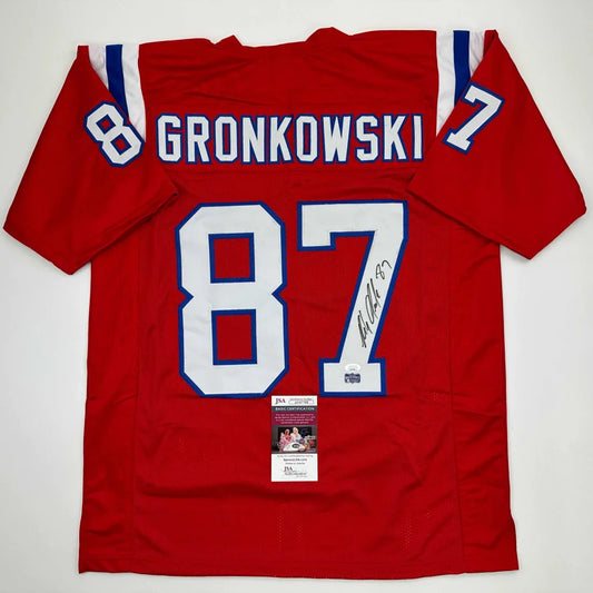 Red and white New England Patriots Gronkowski #87 signed custom jersey from the professional sports league in England red