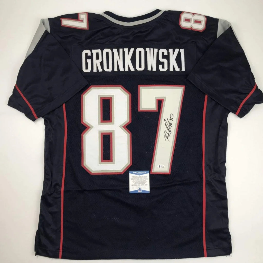 Autographed Rob Gronkowski #87 Custom Jersey with Beckett BAS COA on display