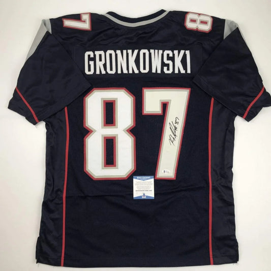Autographed Rob Gronkowski #87 Custom Jersey with Beckett BAS COA on display