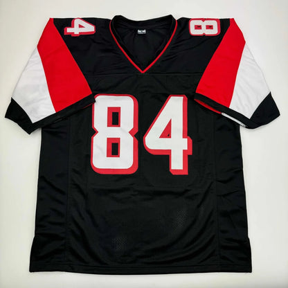 Black sports jersey with red and white accents and number 84, Roddy White Atlanta custom jersey signed with Beckett BAS COA