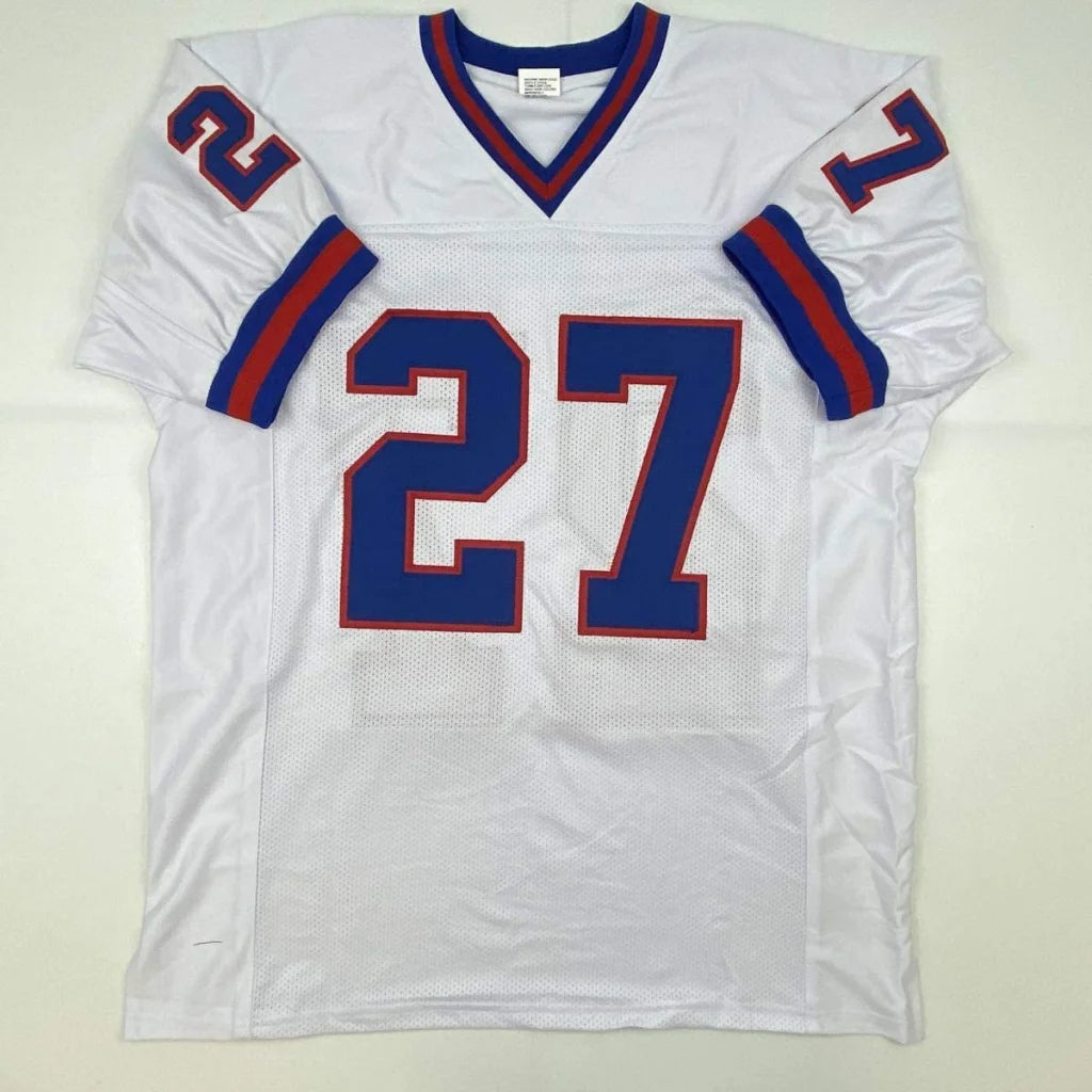 White custom jersey with blue and red trim featuring large blue 27 for professional sports league