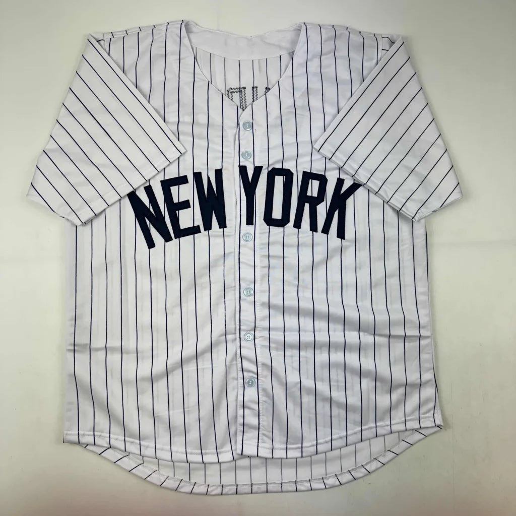 White pinstriped custom jersey with NEW YORK in navy for Ron Guidry sports league collectible