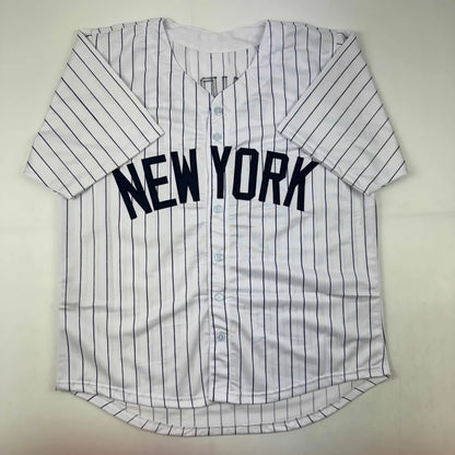 White pinstriped custom jersey with NEW YORK in navy for Ron Guidry sports league collectible