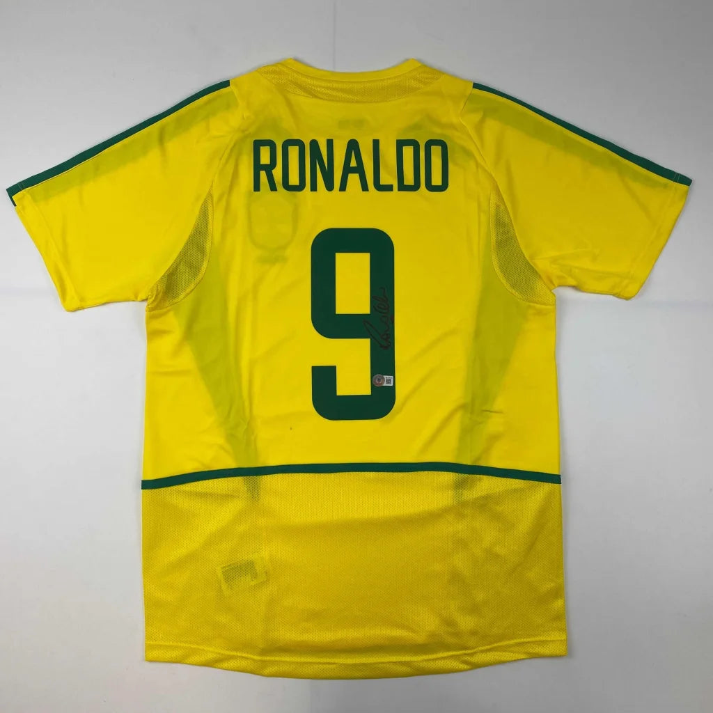 Autographed Ronaldo Nazario Brazil yellow soccer jersey with green trim
