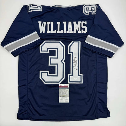 Back view of a navy blue Dallas Cowboys custom jersey with white silver number 31 and autographed by Roy Williams