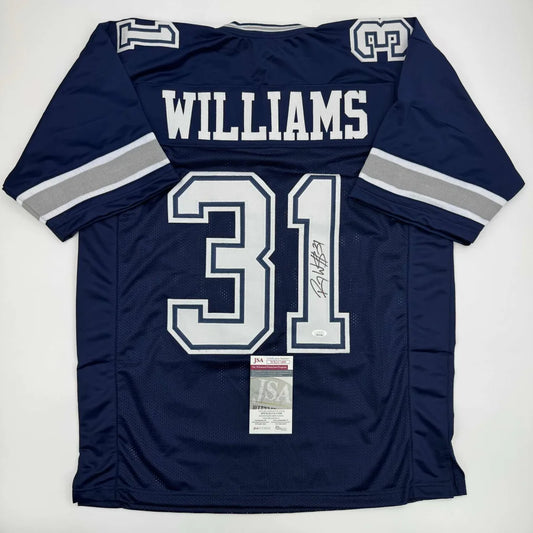 Back view of a navy blue Dallas Cowboys custom jersey with white silver number 31 and autographed by Roy Williams