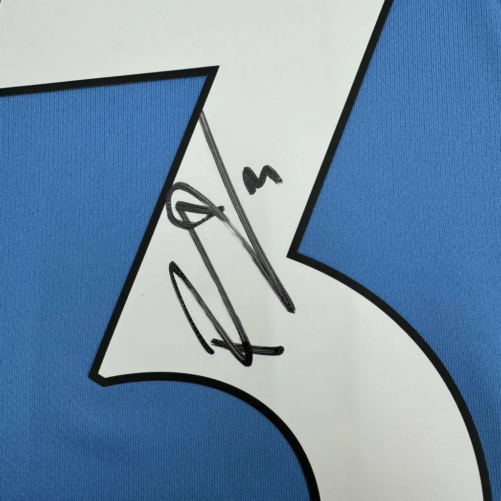 Blue custom jersey with white 7 and black autograph from professional sports league