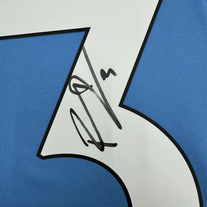 Blue custom jersey with white 7 and black autograph from professional sports league