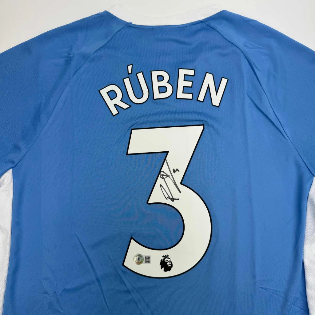 Autographed Ruben Dias Manchester City Blue Soccer Futbol Jersey Beckett BAS COA #2 | Certified Authentic Signed Memorabilia | vintageantiquesgifts.com