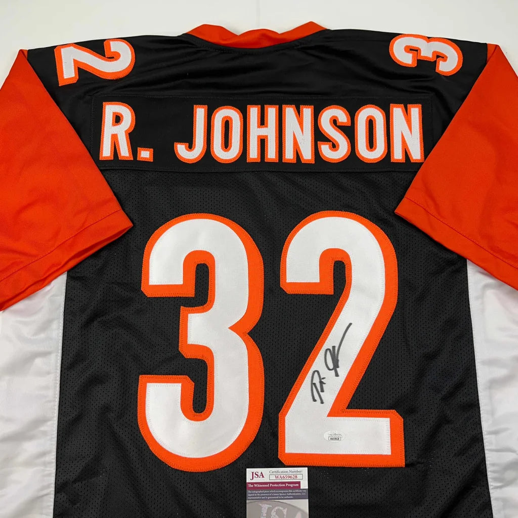 Autographed black and orange custom jersey with R Johnson 32 from professional sports league