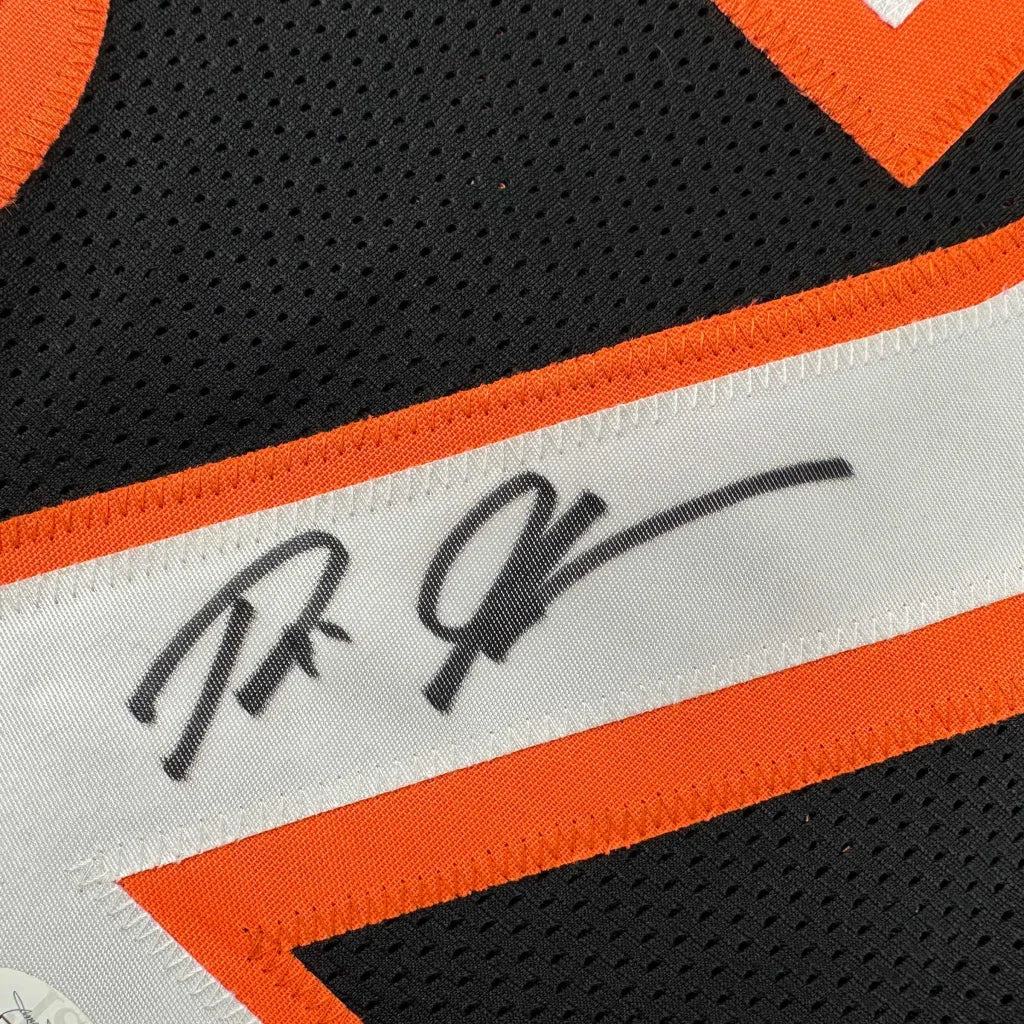 Autographed black and orange custom jersey from professional sports league display