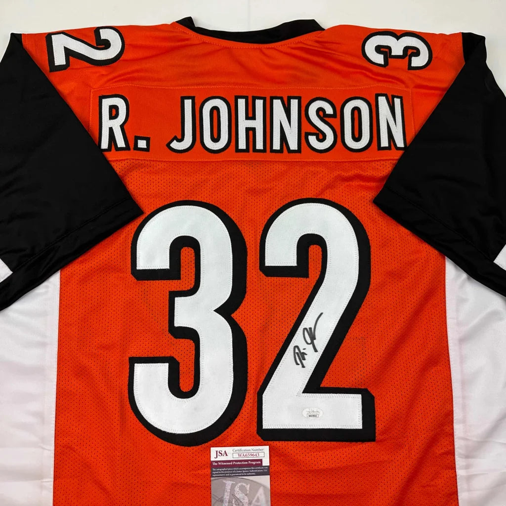 Orange and black custom jersey with number 32 signed by R Johnson from Professional Sports League