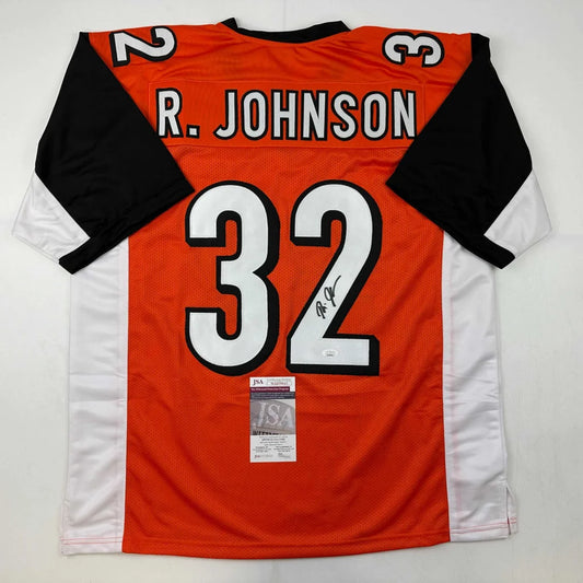 Orange black white custom football jersey signed by R Johnson from Professional Sports League