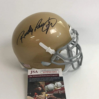 Autographed Rudy Ruettiger gold Notre Dame mini football helmet
