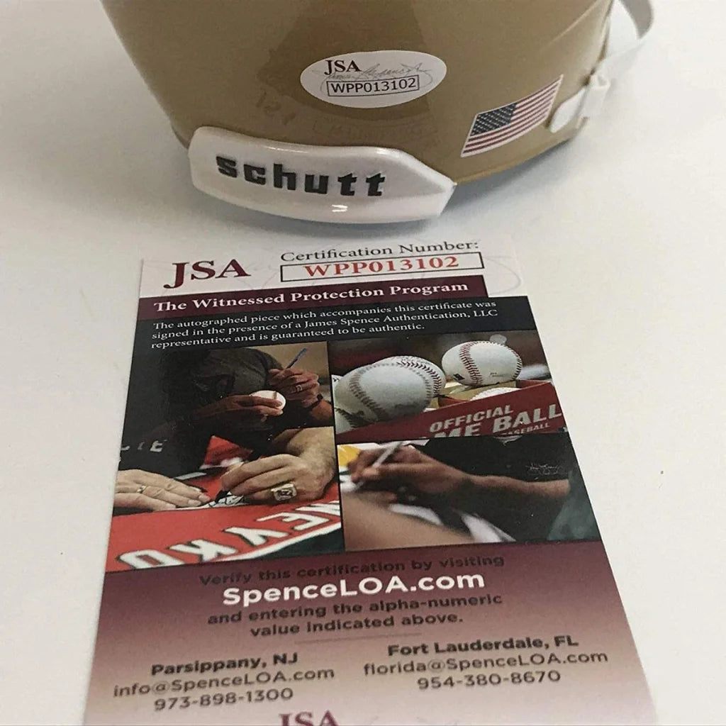 Autographed Rudy Ruettiger Notre Dame tan mini football helmet with flag