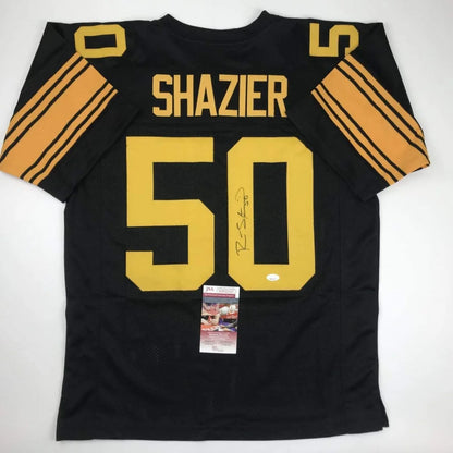 Back of a black and gold autographed ryan shazier pittsburgh color rush football custom jersey from a professional sports league
