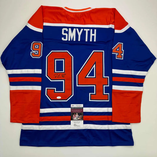 Autographed blue and orange custom jersey with Smyth 94 for professional sports fans