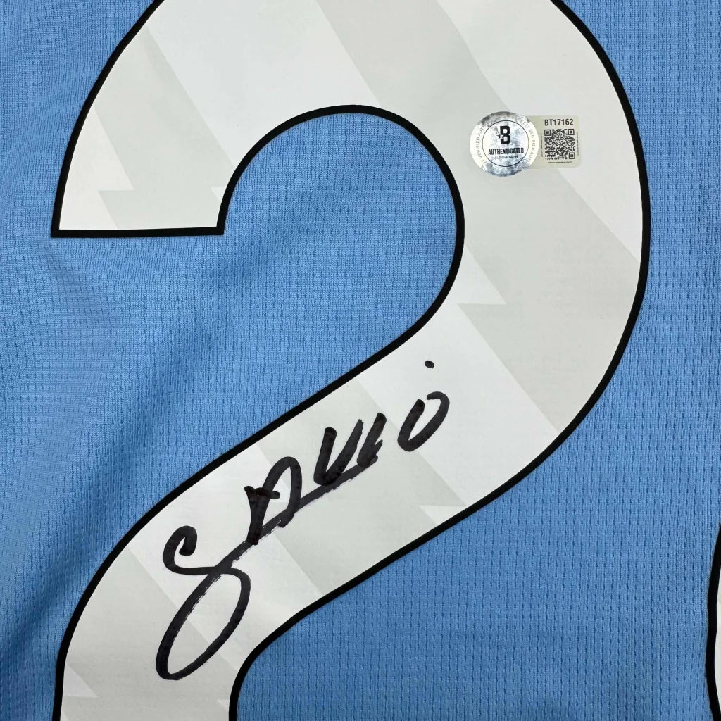 Autographed Savinho Manchester City light blue jersey back with white number 2