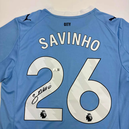 Autographed Savinho Manchester City light blue jersey back with white name and number 26 signature