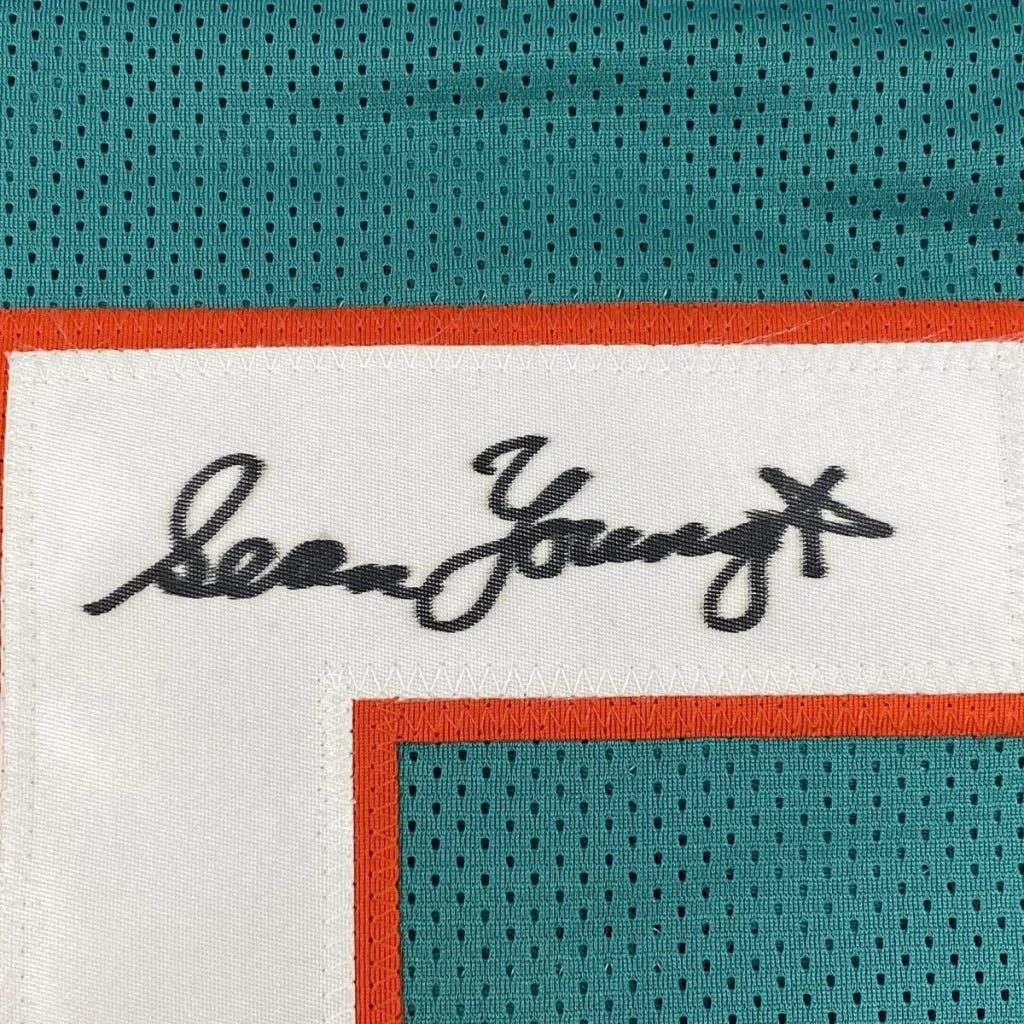 Autographed Sean Young Ray Finkle teal custom jersey with signature patch, PSA/DNA COA