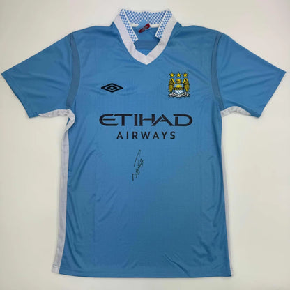 Light blue soccer jersey with white trim and patterned collar, third party authentication included