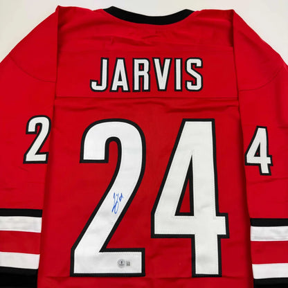 Red custom jersey with JARVIS 24 autograph for hockey fans and professional sports collectors