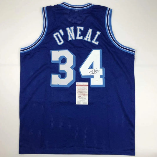 Back of royal blue mesh custom jersey with white light blue lettering showing o neal 34 from professional sports league
