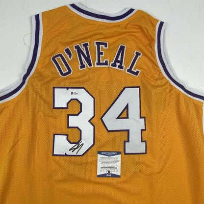 Autographed Shaquille ONeal custom jersey with golden mesh and number 34