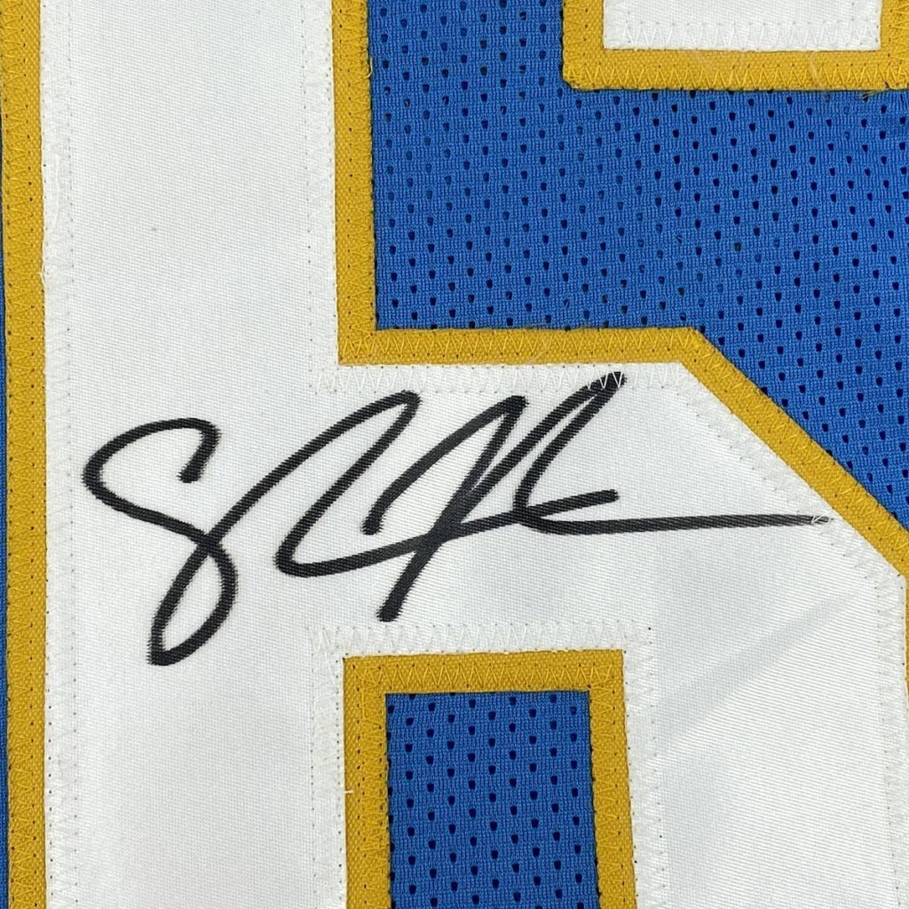 Autographed blue and white custom jersey from a professional sports league collectible