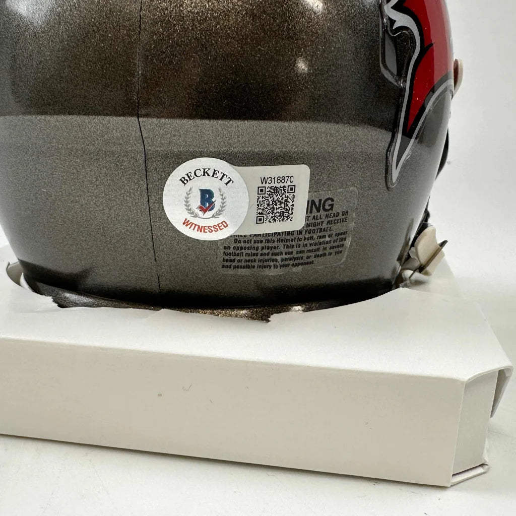 Dark gray Tampa Bay Buccaneers mini helmet with red black design and third party authentication