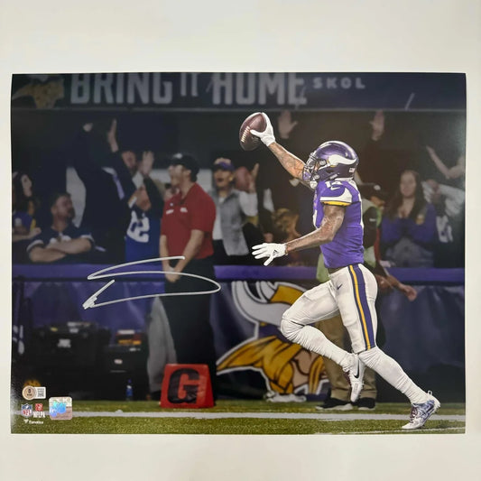 Autographed NFL football player photo with third party authentication in purple jersey