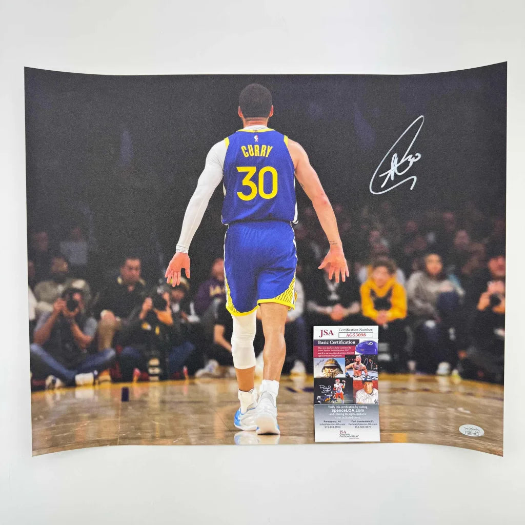 Signed Stephen Curry photo in Warriors jersey with authentication for collectors