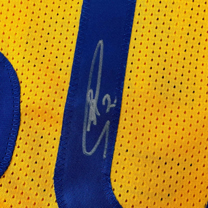Yellow and blue perforated custom jersey with signature from professional sports league