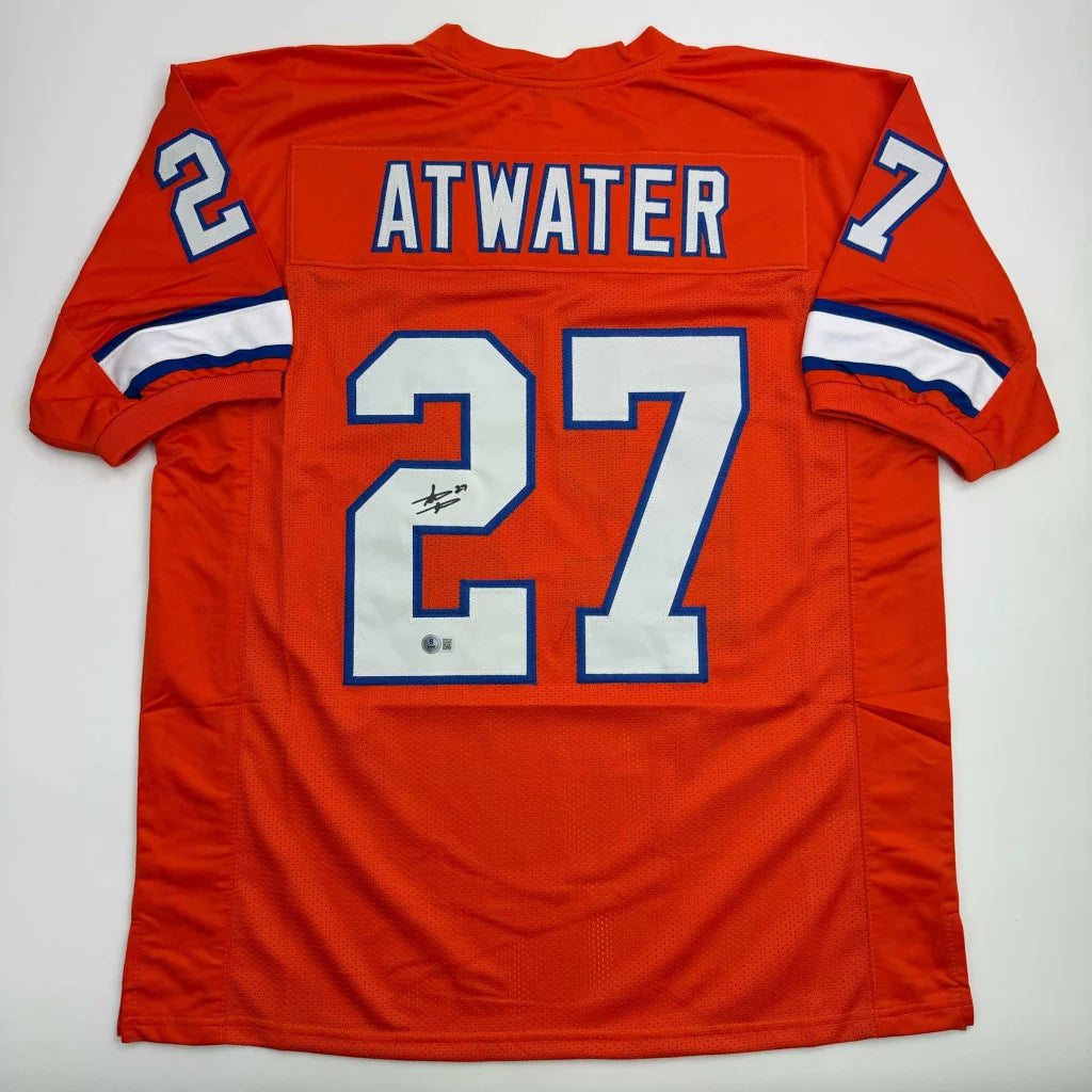 Orange custom jersey with number 27 and signature from a professional sports league