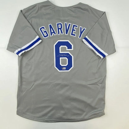 Steve Garvey signed gray custom jersey with blue lettering for pro sports fans