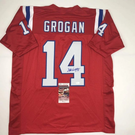 Back of a red custom football jersey with white and blue lettering displaying grogan 14 autographed for professional sports league
