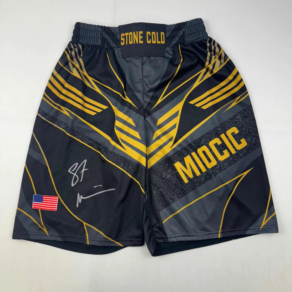 Autographed Stipe Miocic Black and Gold UFC MMA Trunks Shorts Ultimate Fighting Beckett BAS COA | Hall of Fame Sports Memorabilia | vintageantiquesgifts.com