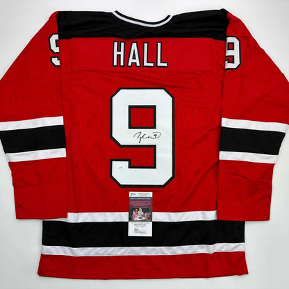Autographed Taylor Hall custom jersey, red with black stripes, name Hall number 9